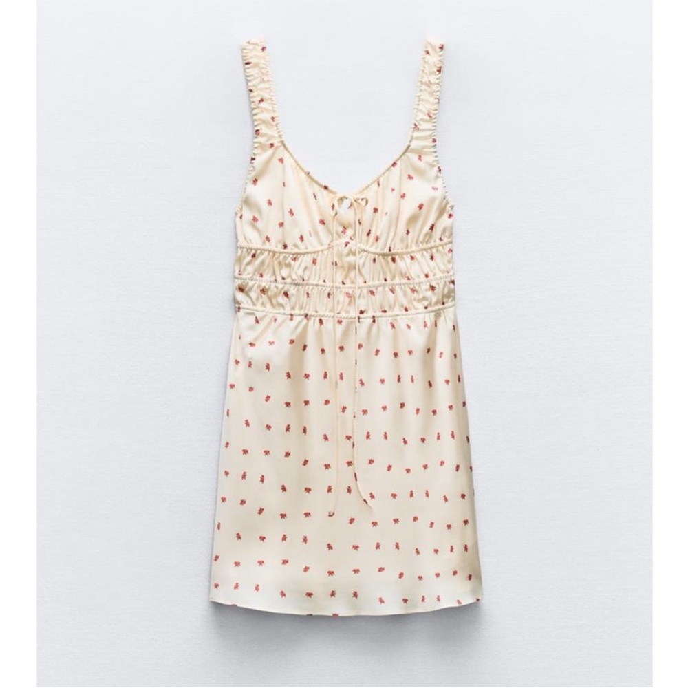 Zara Cream Top with Subtle Red Accents